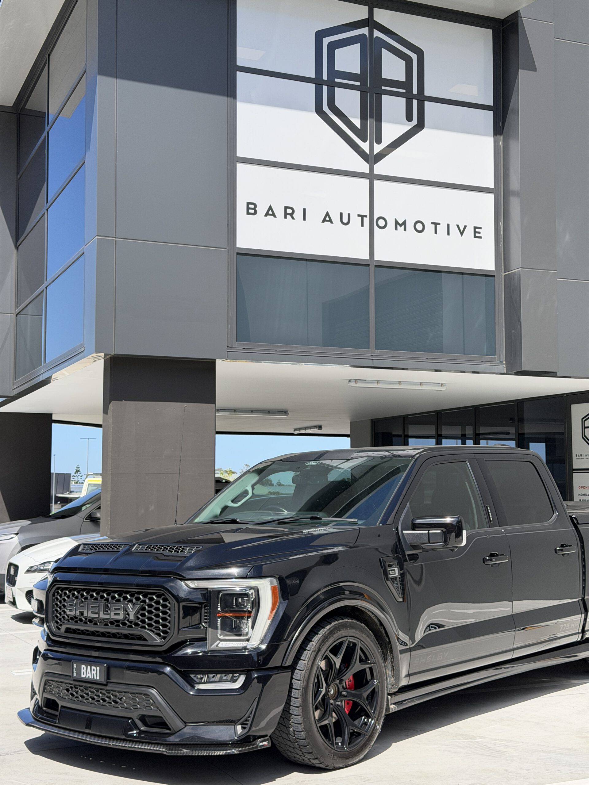 Vehicle in front of Bari Sign